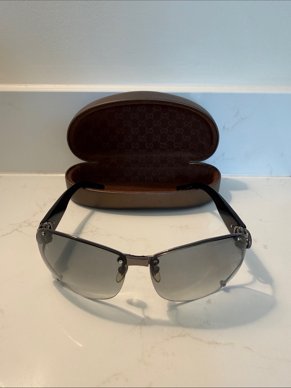Gucci Silver Rimless Sunglasses with Gray Gradient Lenses